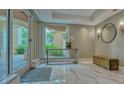 Lobby with seating and view to exterior at 401 N Point Rd # 901, Osprey, FL 34229
