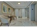 Elegant lobby with marble floors and seating at 401 N Point Rd # 901, Osprey, FL 34229