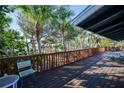 Relaxing deck with wooden railing and ocean views at 7720 Manasota Key Rd, Englewood, FL 34223