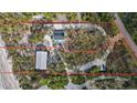 Aerial view of waterfront property with two structures at 7720 Manasota Key Rd, Englewood, FL 34223
