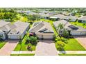 Beautiful home with solar panels, two-car garage, and brick driveway in a lush, well-maintained community at 27855 Arrowhead Cir, Punta Gorda, FL 33982