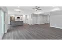 Open concept living and kitchen area with modern island at 214 Lime Tree Park, Rotonda West, FL 33947