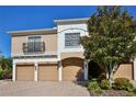 Tan three-unit building with three-car garages and attractive landscaping at 7330 Skybird Rd # 7330, Bradenton, FL 34209