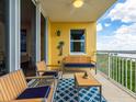 View of the outdoor living area with comfortable seating and water views at 611 Riviera Dunes Way # 308, Palmetto, FL 34221