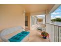 Balcony with wicker furniture and a view of the surrounding area at 4706 Sand Trap Street E Cir # 202, Bradenton, FL 34203