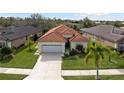 One-story house with tile roof and two-car garage at 5301 Laurel Oak Ct, North Port, FL 34287