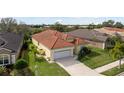 One-story house with tile roof and two-car garage at 5301 Laurel Oak Ct, North Port, FL 34287