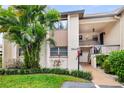 Condo building exterior showcasing entrance and landscaping at 2644 Clubhouse Dr # 101, Sarasota, FL 34232