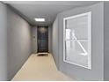 Inviting entryway with modern dark door and light flooring at 392 Aruba Cir # 202, Bradenton, FL 34209