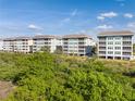 Luxury waterfront community with upscale building exteriors at 392 Aruba Cir # 202, Bradenton, FL 34209