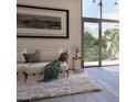 Bright living room featuring comfy seating and large windows at 1305 4Th St # 201E, Sarasota, FL 34236