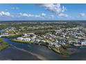 Wide aerial showcasing waterfront homes and community at 1910 Oregon Trl, Englewood, FL 34224