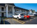 Condo building showcasing parking and building features at 202 47Th Avenue W Dr # 333, Bradenton, FL 34207