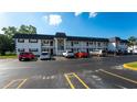 Two-story condo building with ample parking and lush landscaping at 202 47Th Avenue W Dr # 333, Bradenton, FL 34207
