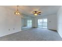 Bright dining area with mirrored wall and sliding glass doors to balcony at 202 47Th Avenue W Dr # 333, Bradenton, FL 34207