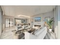 Bright living room boasts a modern fireplace, sleek furniture and an open-concept design connecting to the kitchen at 223 Golden Gate Point # 8B, Sarasota, FL 34236