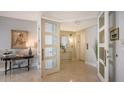 Elegant condo entry with marble floors and access to elevator at 3040 Grand Bay Blvd # 283, Longboat Key, FL 34228