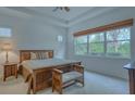 Relaxing main bedroom with a king-size bed and large windows at 12327 Thornhill Ct, Lakewood Ranch, FL 34202