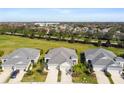 Aerial view of a neighborhood with houses and green spaces at 4618 Deep Creek Ter, Parrish, FL 34219