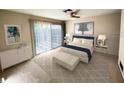 Main bedroom with access to a private balcony at 1210 Casey Key Rd, Nokomis, FL 34275