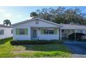 House exterior showcasing a single-story home with a carport at 6033 Arlene Way # 3, Bradenton, FL 34207