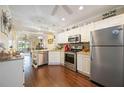 Spacious kitchen featuring stainless steel appliances and wood flooring at 26356 Nadir Rd # 101, Punta Gorda, FL 33983