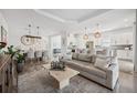 Bright, open-concept living area with modern finishes and natural light flowing into the kitchen and dining areas at 6266 Mesa Gln, Bradenton, FL 34203