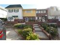 Townhome with brick and siding, steps to entrance at 705 W Venice Ave # 705-B, Venice, FL 34285
