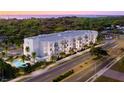 Modern building near waterfront at sunset at 4950 Remington Dr # 107, Sarasota, FL 34234