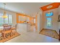 Open concept kitchen with granite countertops and white cabinetry at 8146 Stirling Falls Cir, Sarasota, FL 34243