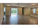Spacious living room featuring tile floors and sliding glass doors leading to the backyard at 2275 Hamburg Ln, Punta Gorda, FL 33983