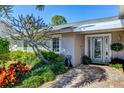 Inviting front entrance with landscaped walkway and teal door at 8108 12Th Nw Ave, Bradenton, FL 34209