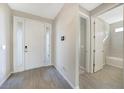 Bright entryway with tile floors and access to a bathroom at 2275 Hamburg Ln, Punta Gorda, FL 33983