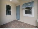 Front porch with light blue door and tile floor at 227 Okeeffe Cir, Bradenton, FL 34212