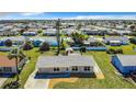 Aerial view of a Ranch style home and surrounding houses at 13497 Bennett Dr, Port Charlotte, FL 33981