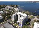Condo building featuring private balconies with beautiful bay views, palm trees, and modern design at 1400 Barcarrota Blvd W # 201, Bradenton, FL 34205