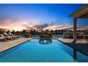 Stunning pool with lake view at sunset at 20910 Parkstone Ter, Bradenton, FL 34202
