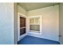 Small private patio with exterior door and window at 1779 San Silvestro Dr, Venice, FL 34285