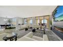 Bright living room with water views and fireplace at 611 Riviera Dunes Way # 702, Palmetto, FL 34221