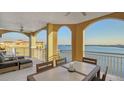 Balcony with outdoor furniture and water views at 611 Riviera Dunes Way # 702, Palmetto, FL 34221