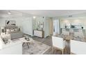 Open concept living area with modern furniture and a spacious feel at 4576 Ringwood Mdw # 5, Sarasota, FL 34235