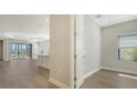 Open floor plan with hardwood floors and office at 27460 Janzen Ct, Englewood, FL 34223