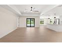 Open living space with tile floors and sliding glass doors at 196 Arch Dr, Rotonda West, FL 33947