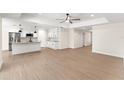 Modern kitchen with white cabinets, granite counters, and island at 196 Arch Dr, Rotonda West, FL 33947
