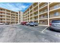 Condo building with parking lot and nicely landscaped grounds at 3514 Lake Bayshore Dr # K-108, Bradenton, FL 34205