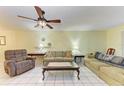 Bright and airy living room with comfortable seating and large windows at 3514 Lake Bayshore Dr # K-108, Bradenton, FL 34205