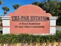 Tri-Par Estates 55+ deed restricted community sign at 1709 Olympia Fields St, Sarasota, FL 34234