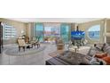 Bright living room features a leather couch, round table and large windows with views of the city at 1771 Ringling Blvd # 604, Sarasota, FL 34236