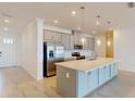 Modern kitchen with stainless steel appliances and an island at 1575 Laurel Brook Ln, Port Charlotte, FL 33953