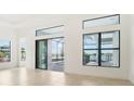 Bright living room with sliding glass doors opening to pool area at 524 Bocelli Dr, North Venice, FL 34275